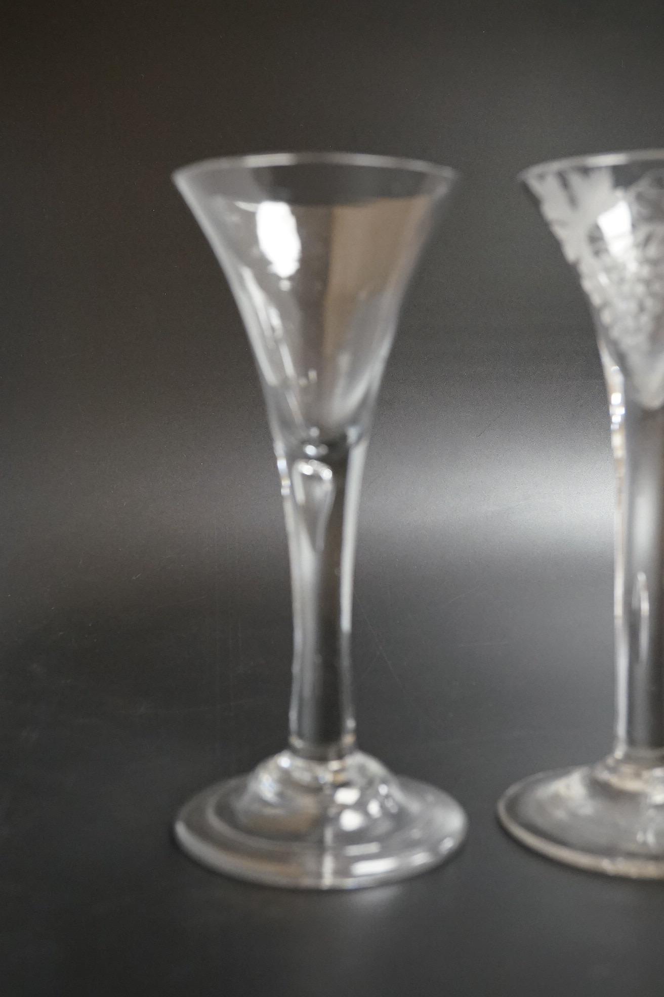 Two 18th century glass wine flutes, one with folded foot, tallest 16cm high